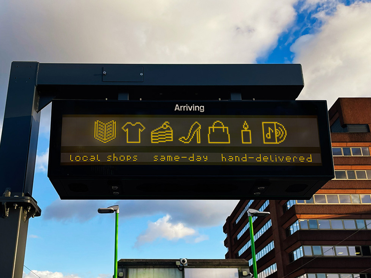 Local shops arriving advertisement on station timetable.