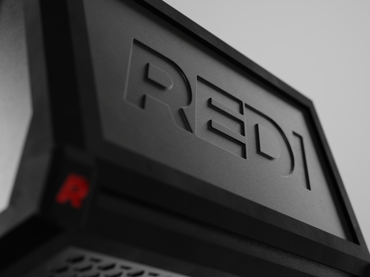 A close up of the debossed REDI logo on the back of the REDI device