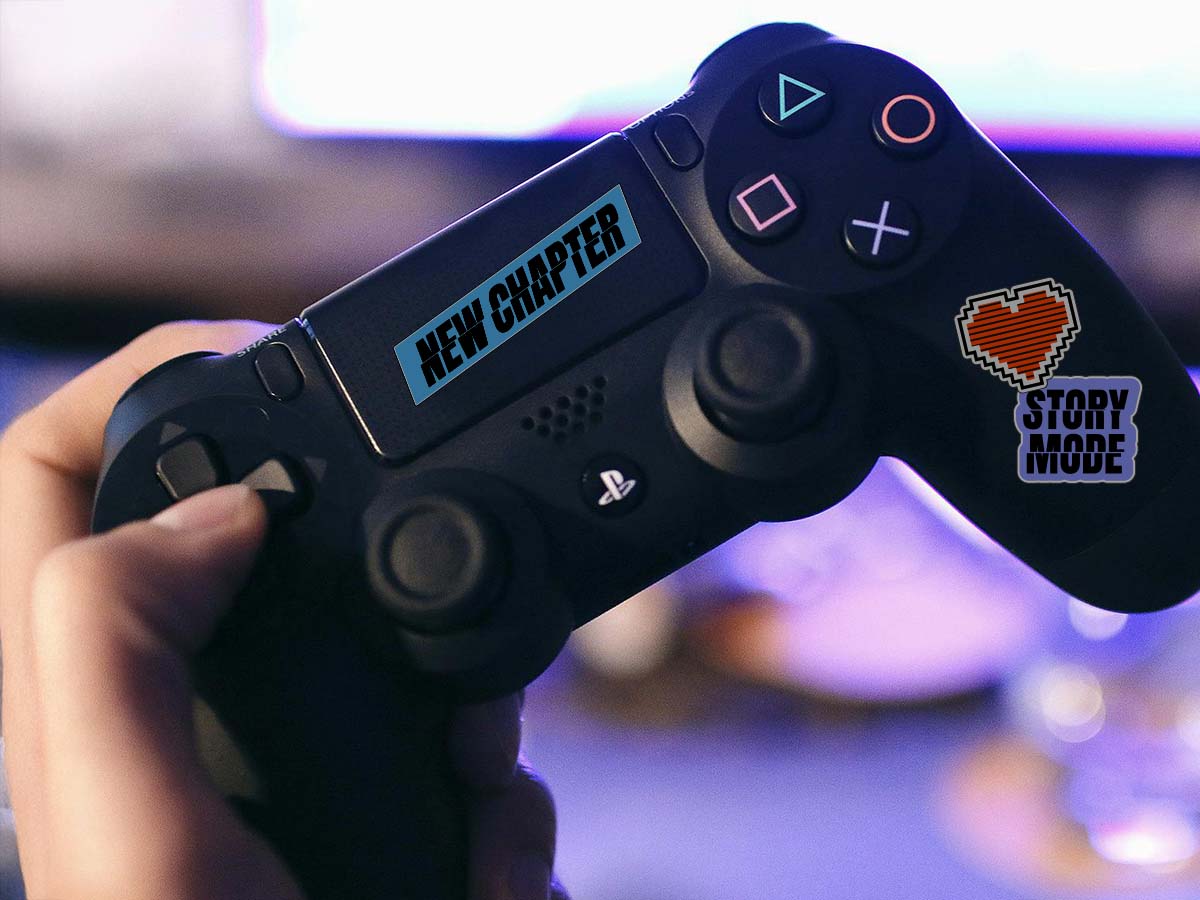 A PS5 controller with New Chapter stickers stuck on it.