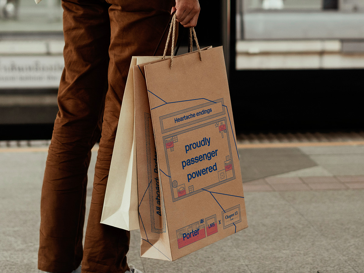 Passenger carrying Porter branded carrier bag.
