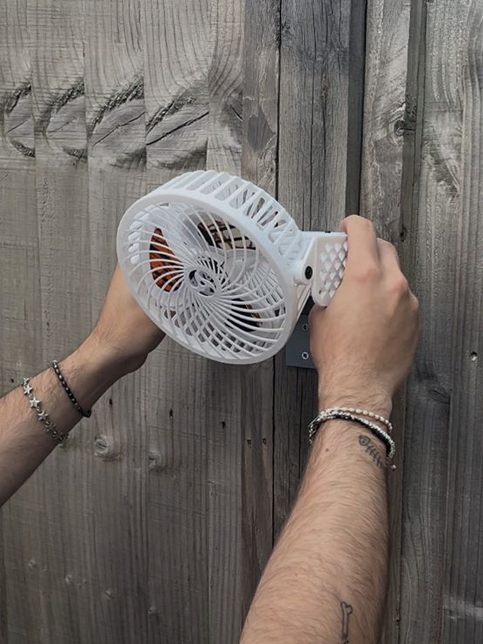 Fan mounting to wall bracket